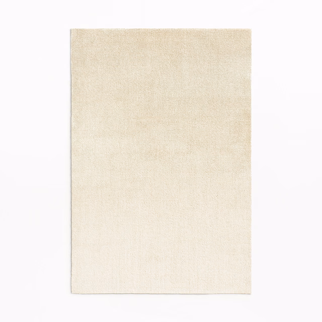 Pale champagne ivory velvet swatch with a softly luminous, subtly textured surface