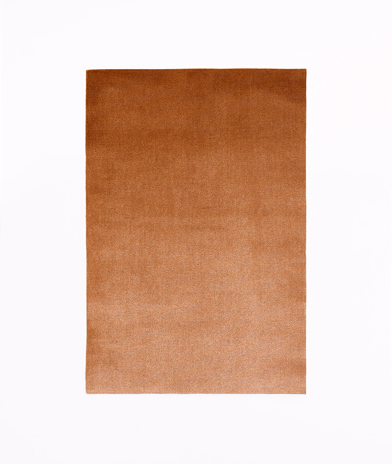Warm cinnamon velvet swatch with darker rust nap fading to a coppery lower tone