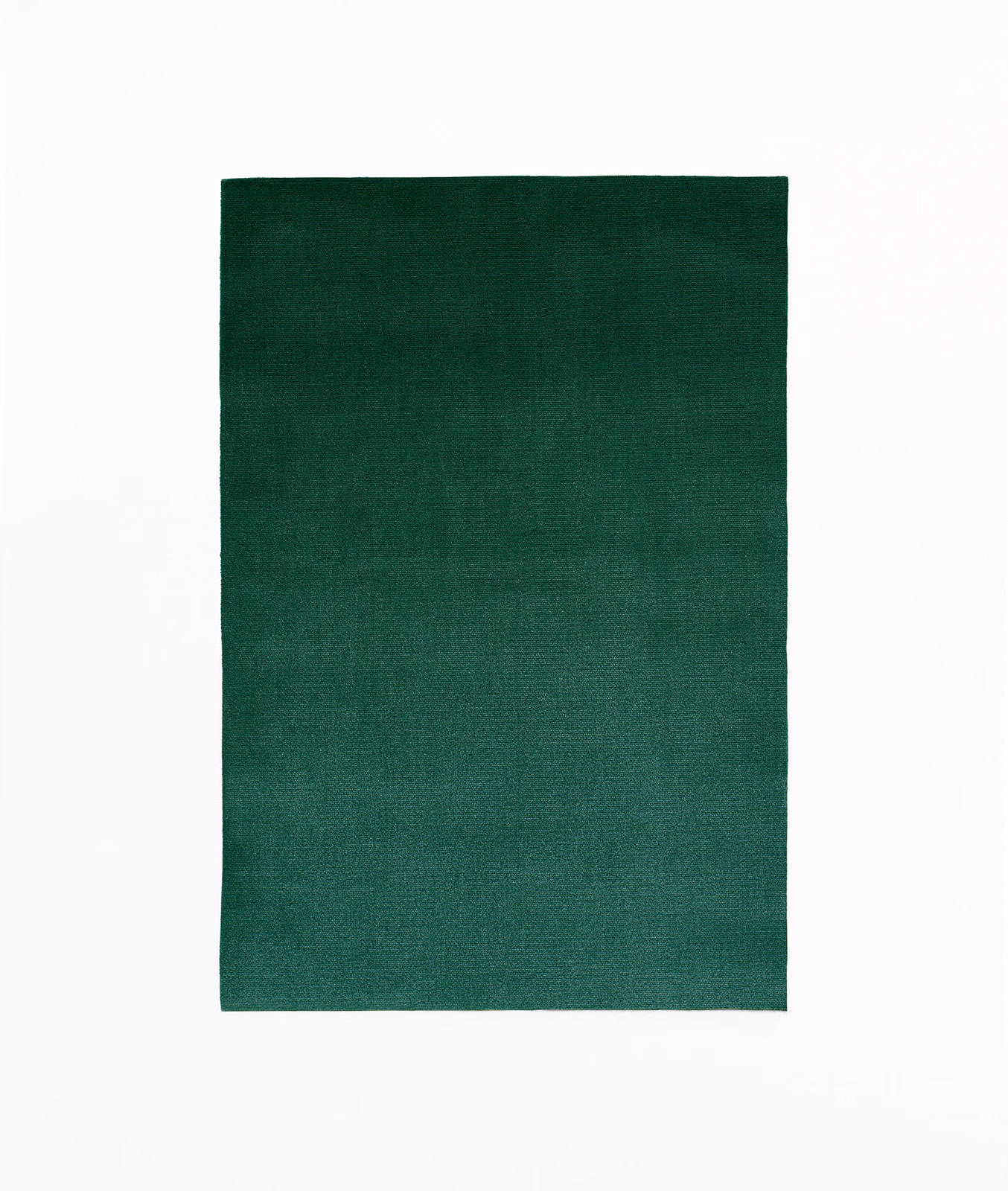 Deep forest-green velvet swatch with subtle nap and softly shifting surface sheen