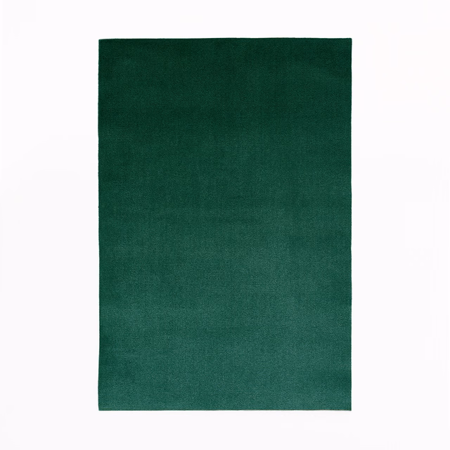 Deep forest-green velvet swatch with subtle nap and softly shifting surface sheen