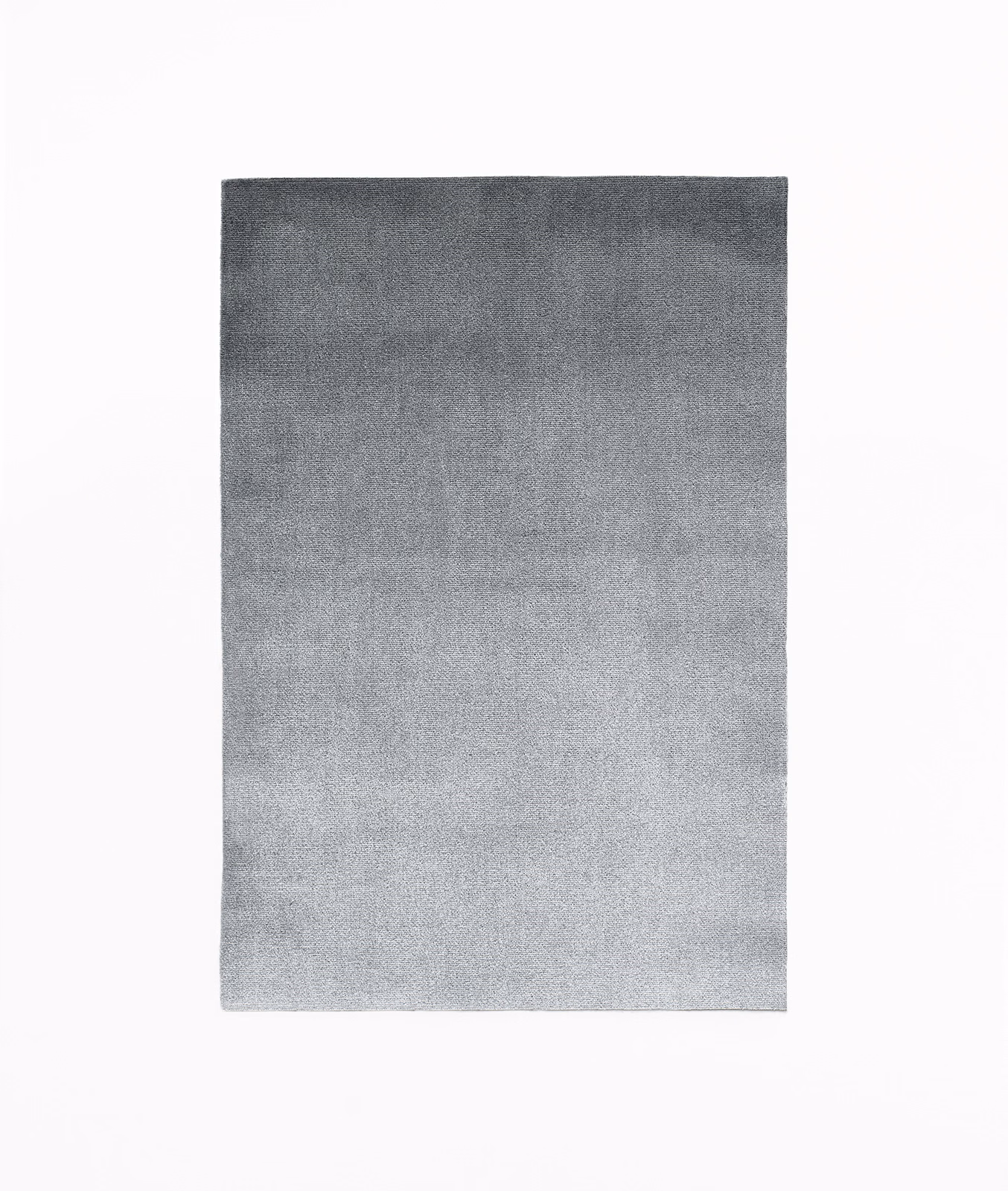 Graduated grey velvet swatch shifting from charcoal top to pale silver bottom