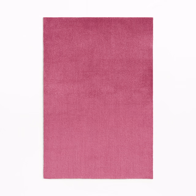 Rich magenta pink velvet swatch showing subtle directional pile and tonal surface variation