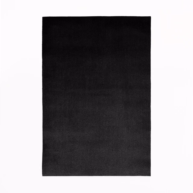 Near-black velvet swatch showing a subtle directional nap and charcoal sheen