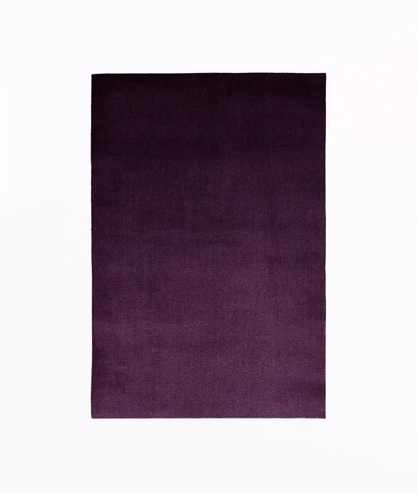 Deep plum velvet swatch showing subtle nap variation and darker upper shading