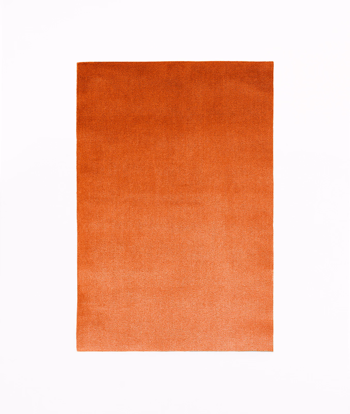 Warm burnt-orange velvet swatch with softly shifting nap and lighter coral lower edge