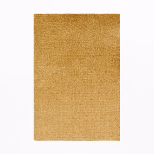 Warm ochre-gold velvet swatch with a softly brushed, subtly shifting surface