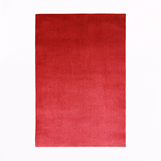 Deep rouge red velvet with a subtly shifting, close-cut pile