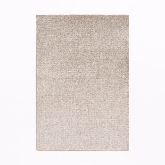 Warm sandy beige velvet swatch with a fine pile and subtle vertical nap shading