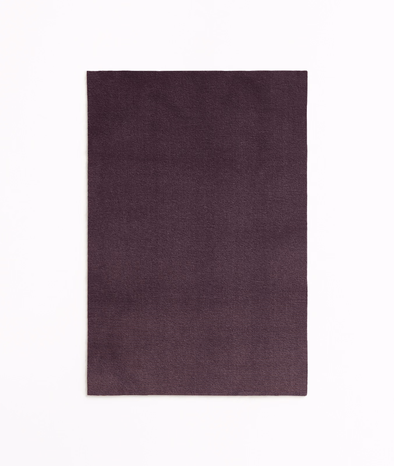 Deep aubergine velvet swatch with a fine, subtly mottled surface