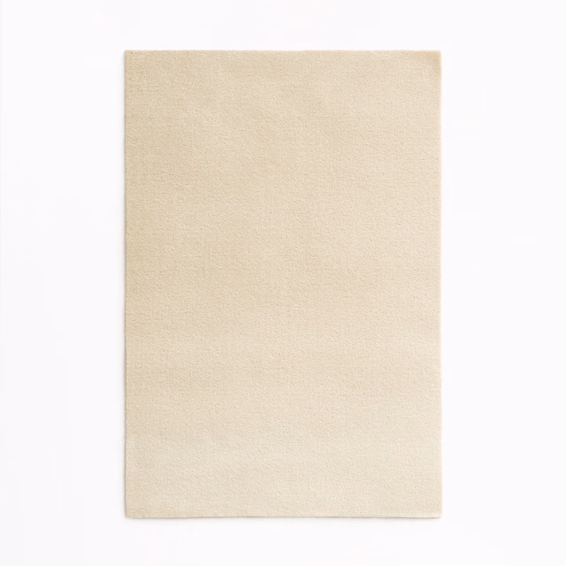 Warm ivory velvet swatch with a fine, softly light-catching nap