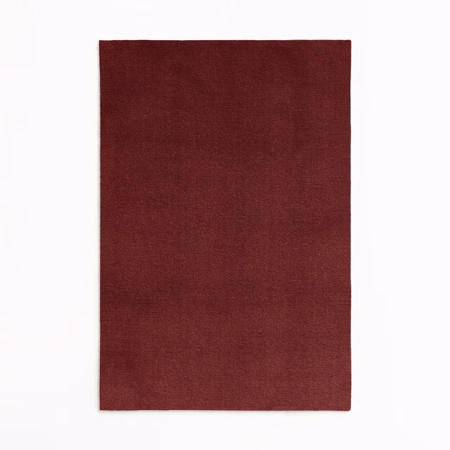 Deep Bordeaux burgundy velvet swatch with subtle directional pile and tonal shading