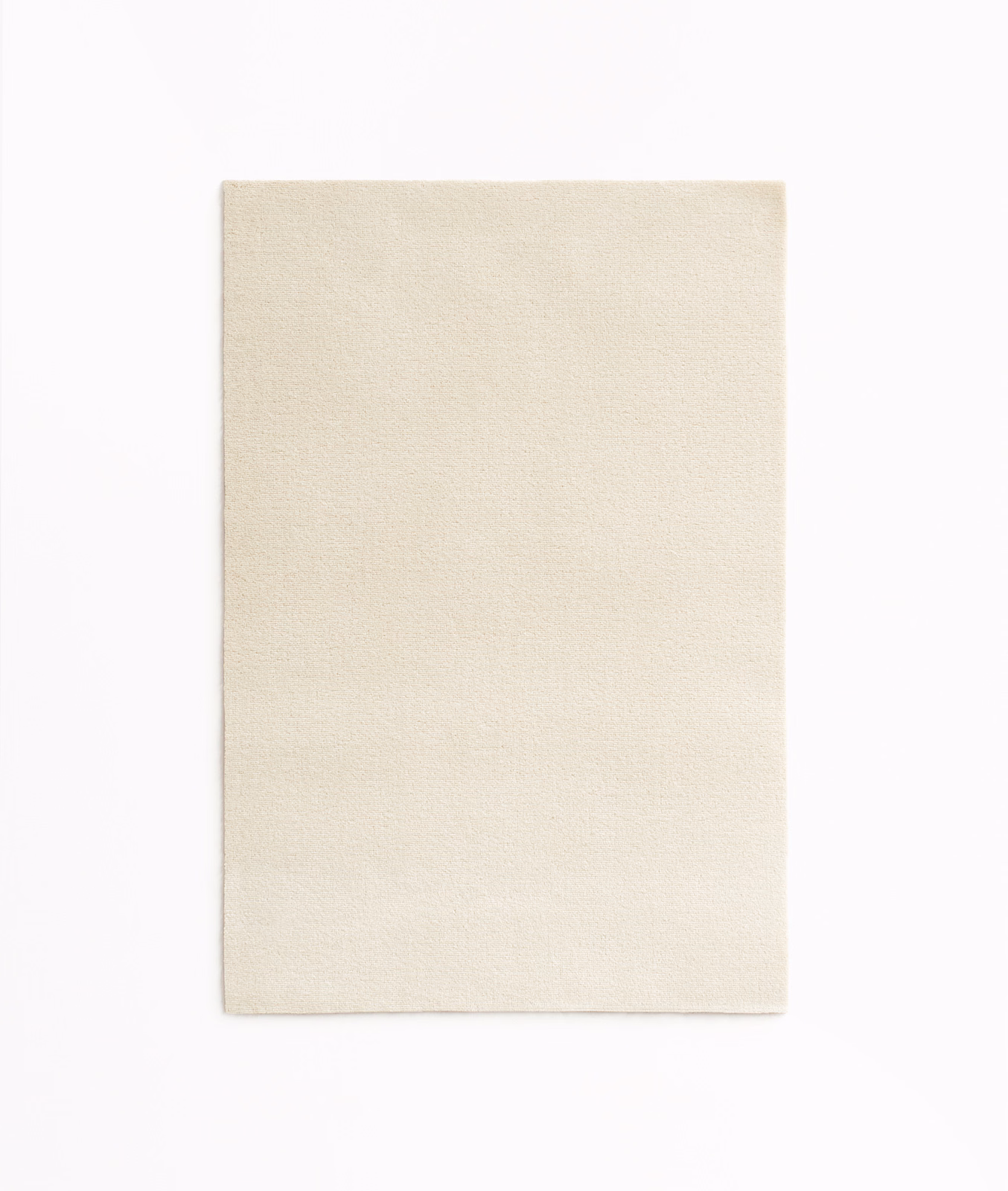 Pale ivory cream velvet swatch showing a fine, softly brushed nap
