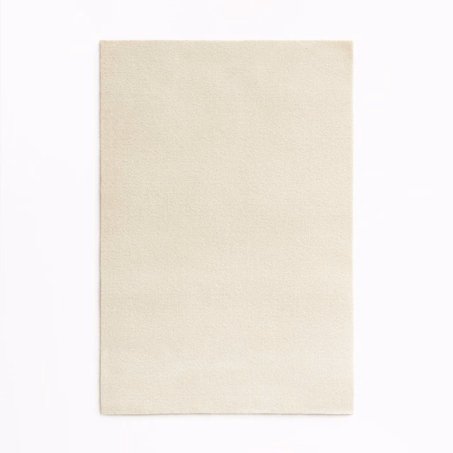 Pale ivory cream velvet swatch showing a fine, softly brushed nap