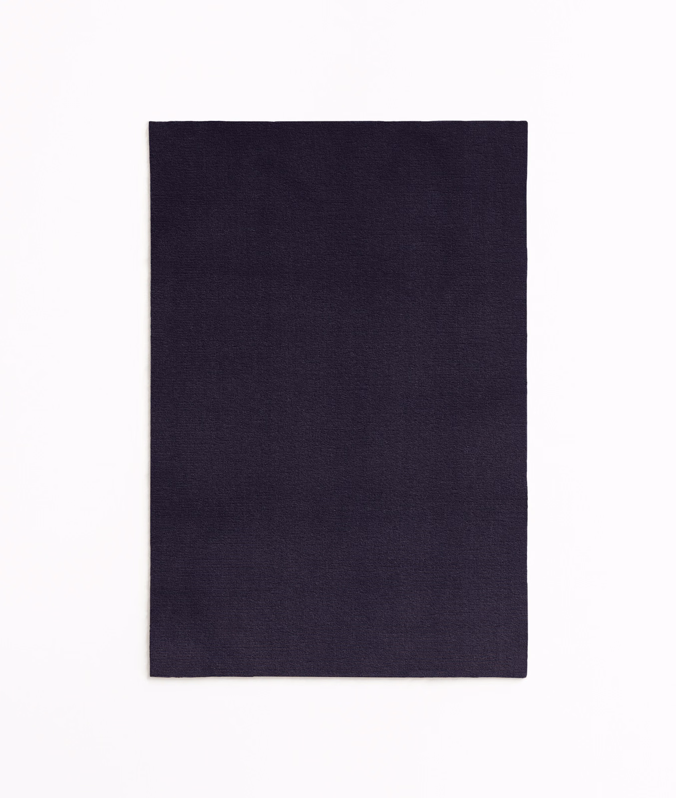 Deep ink-blue velvet swatch with subtle black shading across its plain, softly lustrous pile