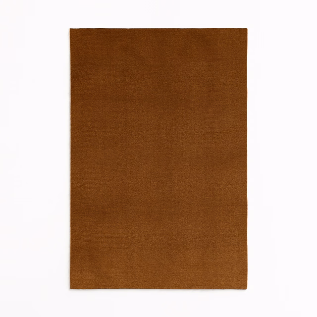 Warm tobacco-brown velvet swatch showing a softly shaded, plain nap