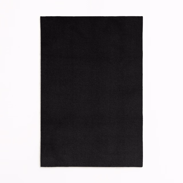 Close-up of Sansone Nero’s near-black velvet with a quiet directional sheen