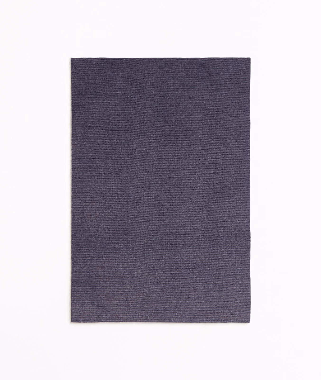 Smoky plum-purple velvet swatch with subtle directional nap and quiet tonal variation