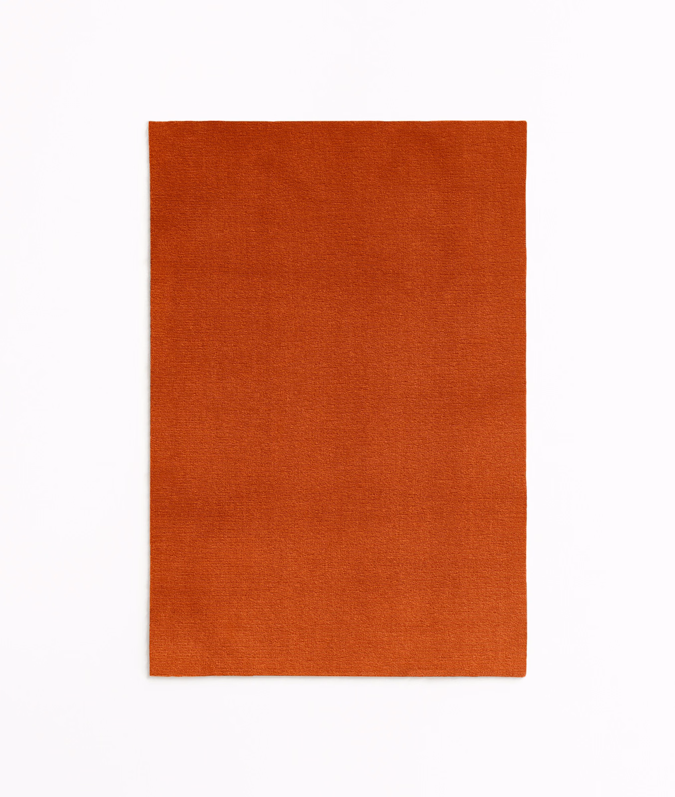 Burnt-orange terracotta velvet swatch with a fine, softly shifting plain pile