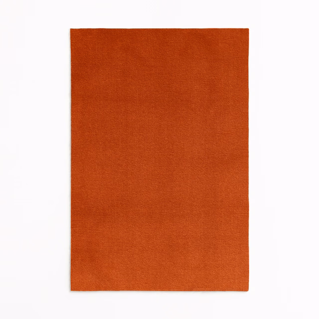 Burnt-orange terracotta velvet swatch with a fine, softly shifting plain pile