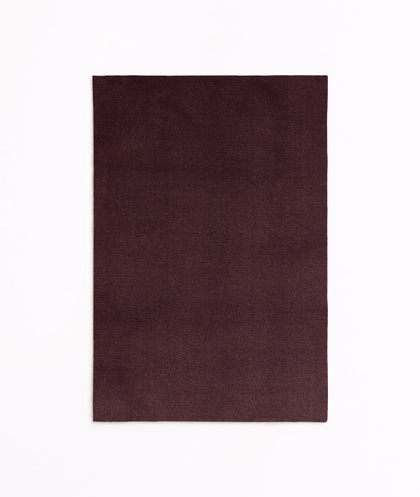 Deep plum burgundy velvet swatch with subtle directional nap and tonal shading
