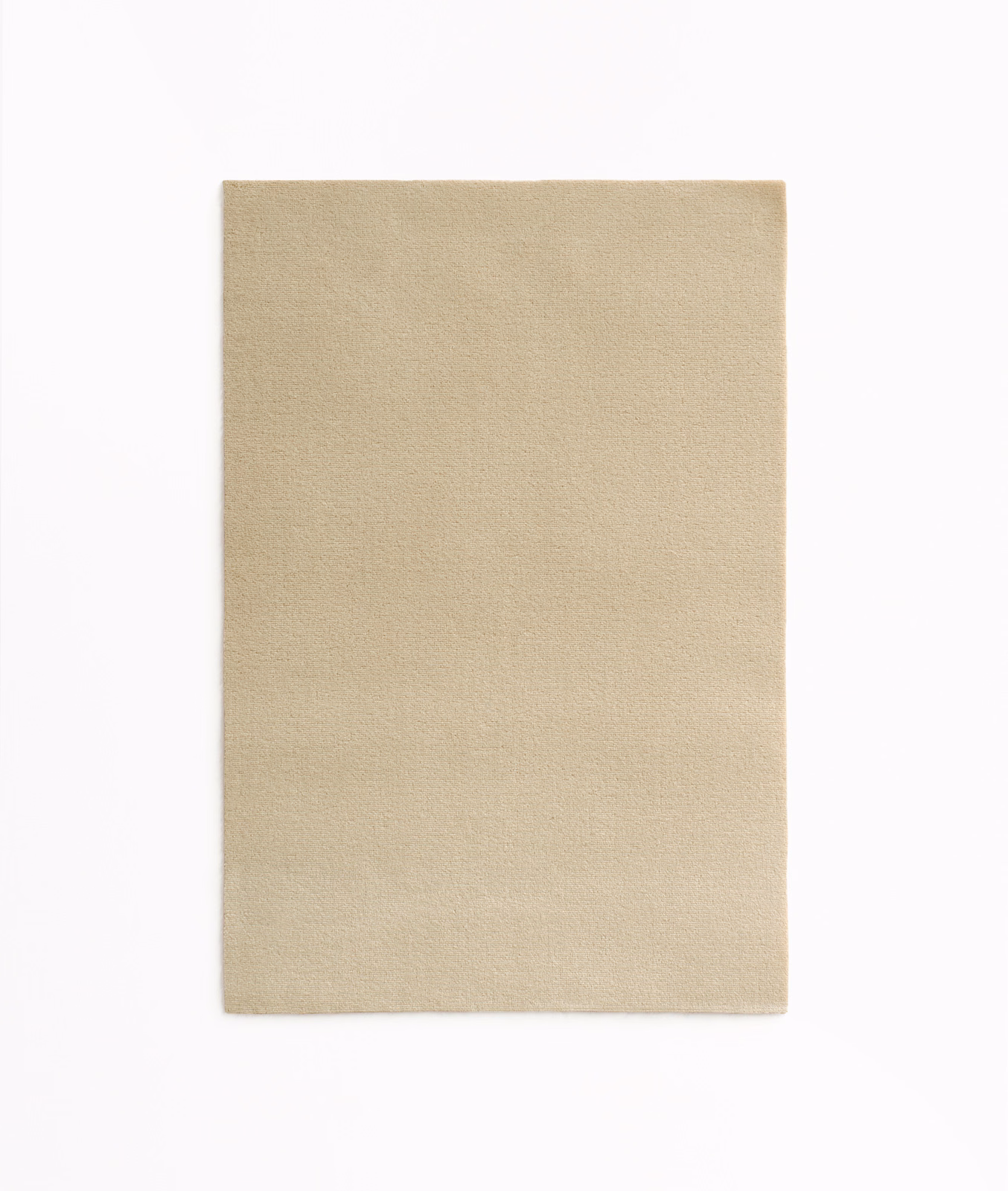 Warm sandy beige velvet swatch showing a smooth, subtly brushed nap