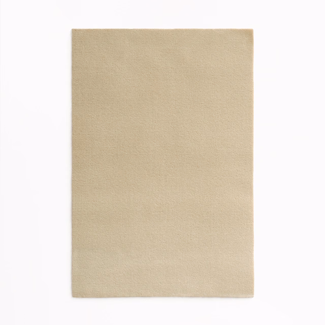 Warm sandy beige velvet swatch showing a smooth, subtly brushed nap