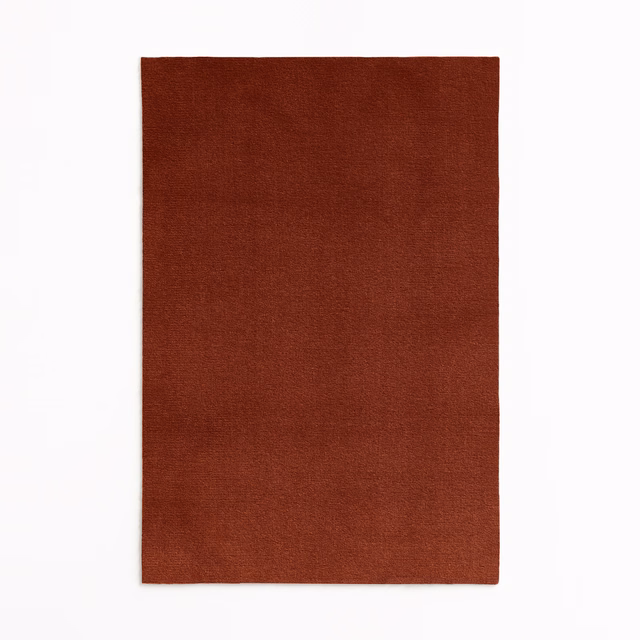 Plain deep terracotta velvet swatch with a softly shaded brushed nap