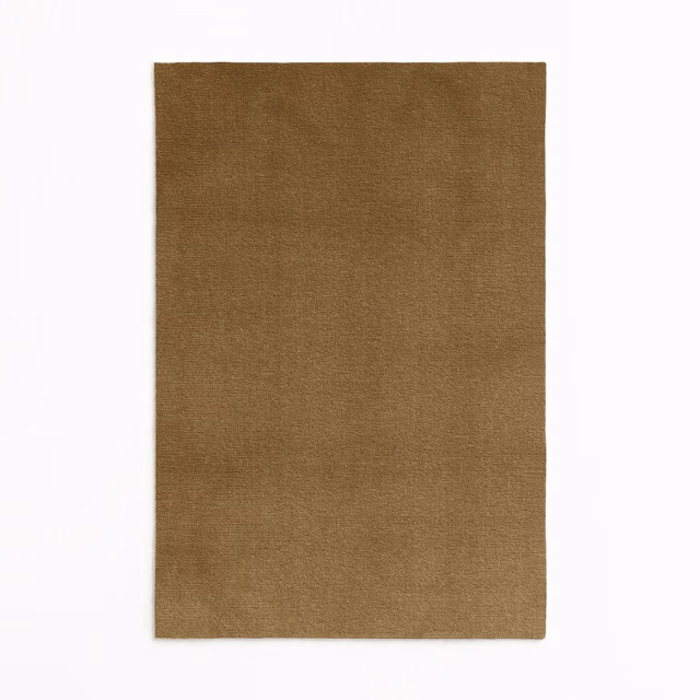 Warm umber-brown velvet swatch with subtly mottled, light-catching plain nap