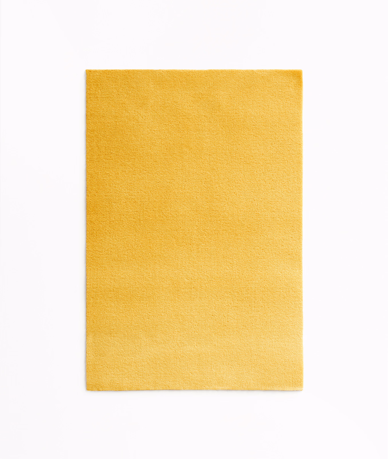 Sunflower-yellow velvet swatch with a softly brushed, subtly directional pile