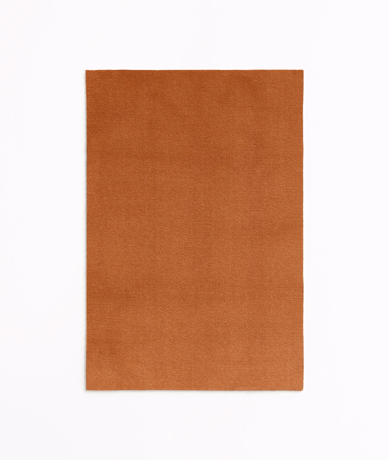 Plain burnt-terracotta velvet swatch with a softly brushed, light-catching surface