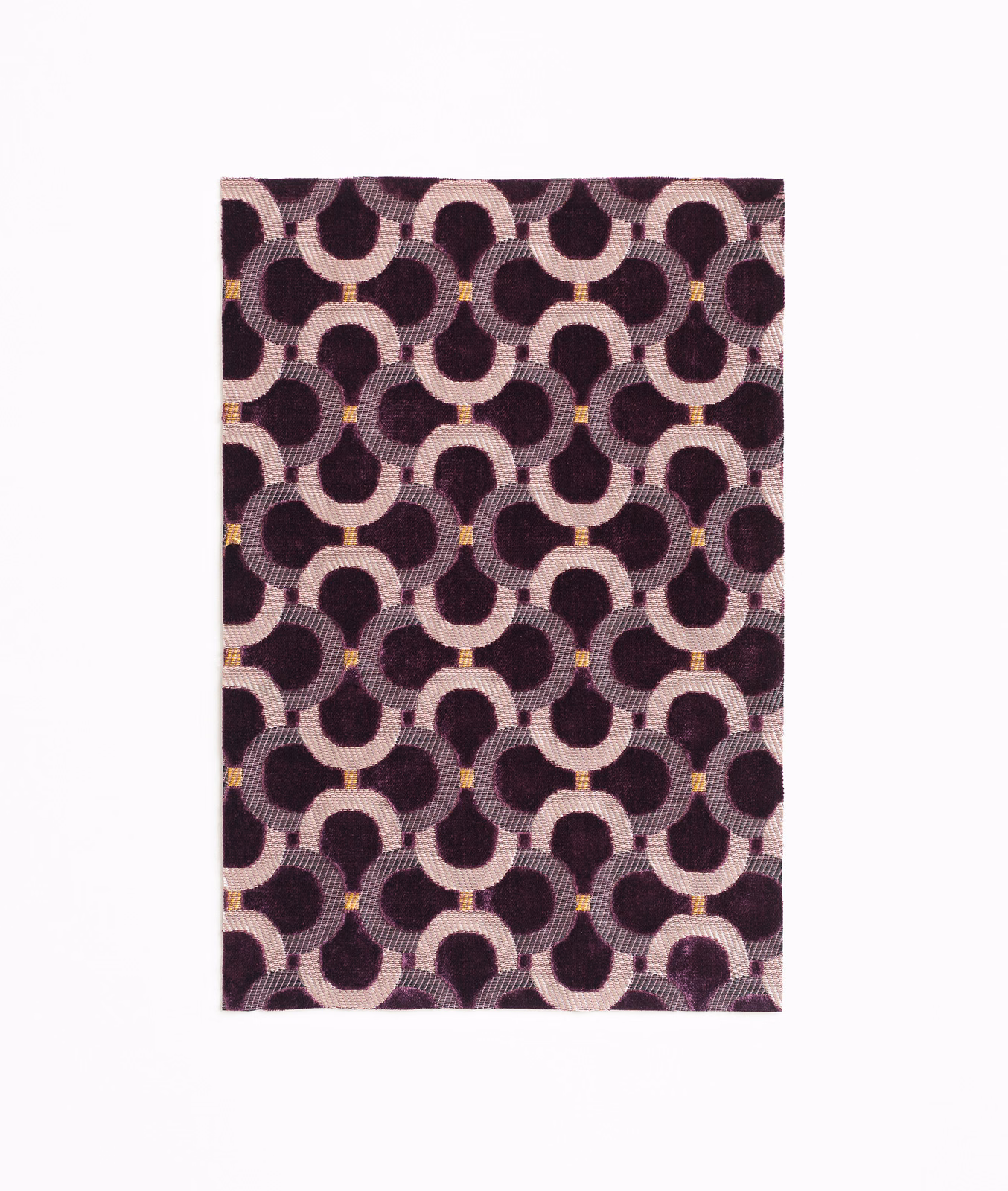 Deep plum velvet with blush interlocking arches, ribbed texture and tiny gold accents