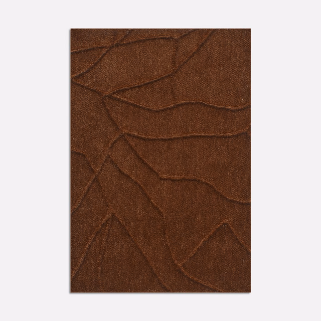 Deep tobacco-brown velvet with raised abstract branching lines and a softly lustrous pile