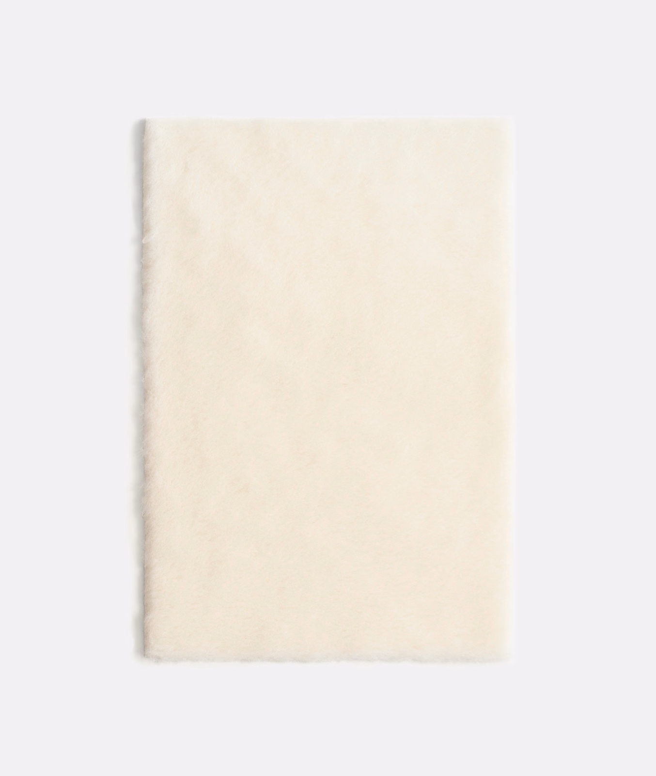Pale ivory velvet swatch showing a softly brushed, subtly clouded plush surface