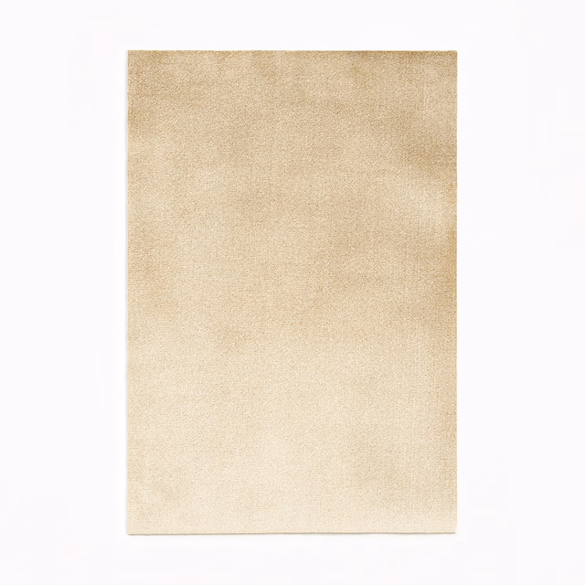 Pale warm ivory velvet swatch with softly mottled plush texture and subtle tonal depth