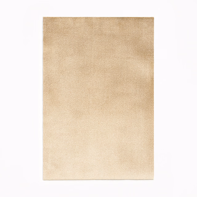 Warm pale beige velvet swatch with softly mottled nap and subtle tonal shading
