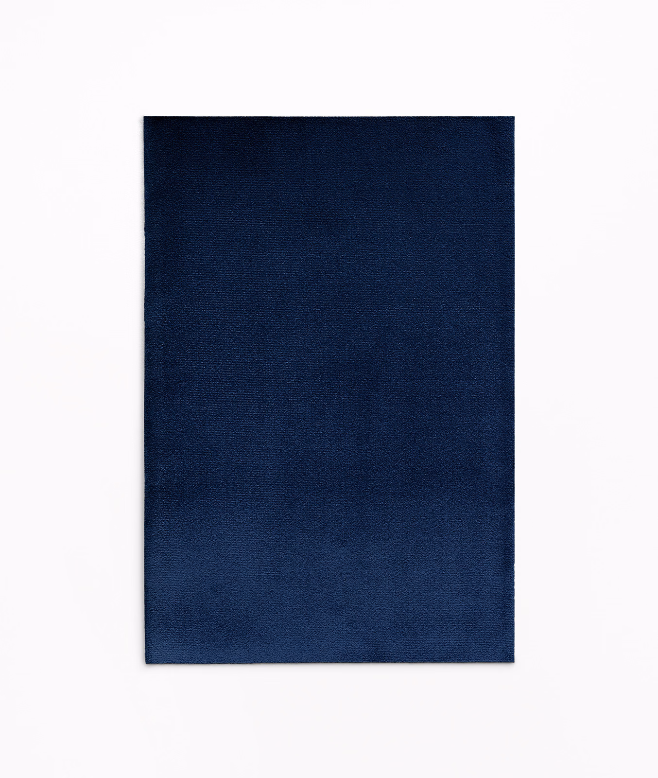 Deep midnight-blue velvet swatch showing subtle directional sheen across its plain surface