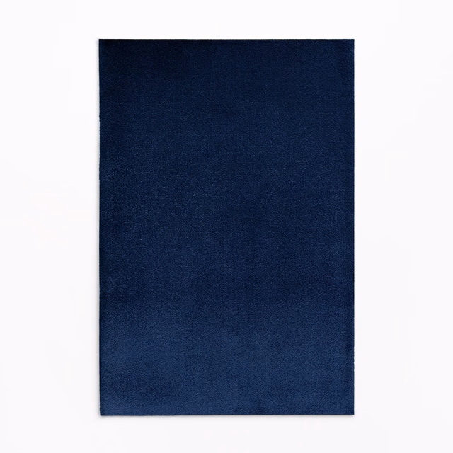Deep midnight-blue velvet swatch showing subtle directional sheen across its plain surface