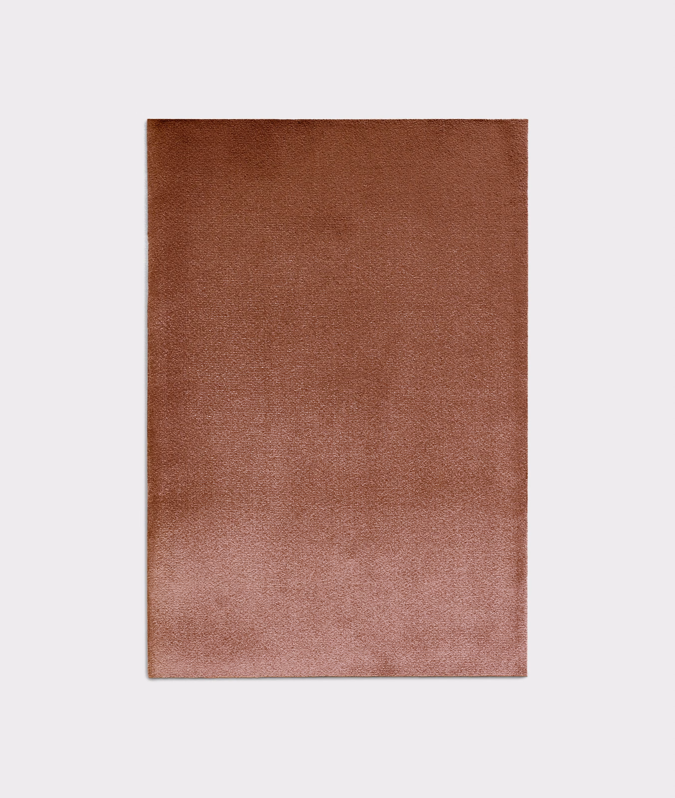 Bourbon-brown velvet swatch shifting to dusty rose with a soft directional sheen