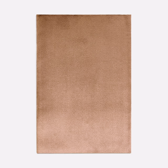 Warm peach velvet swatch with softly brushed pile and subtle tonal shading