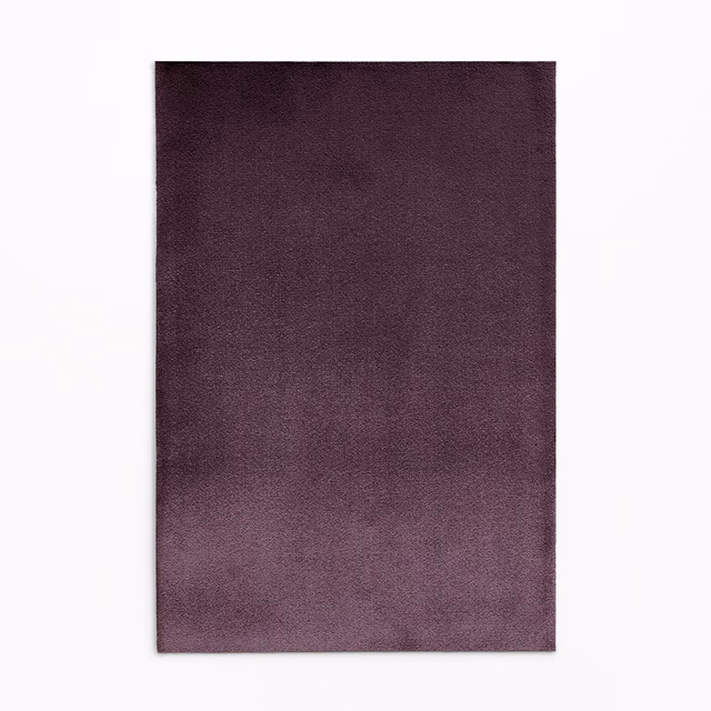 Dusky plum-purple velvet showing a soft short pile and smoky tonal variation
