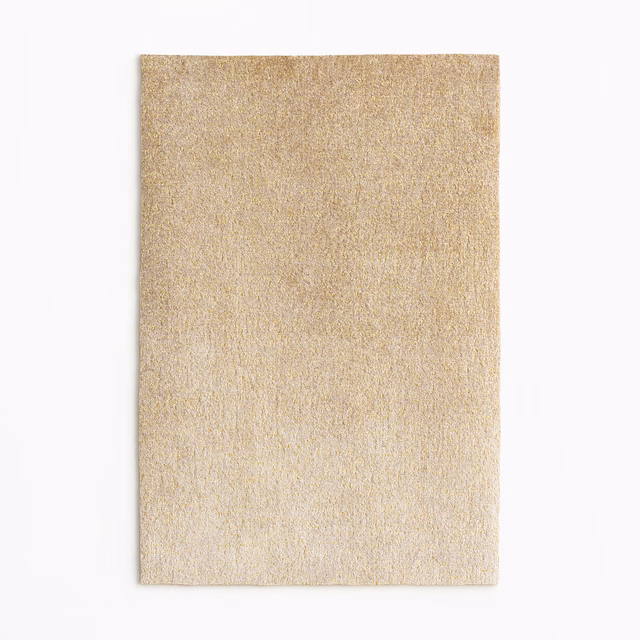 Warm beige velvet swatch with fine texture and subtle golden sheen