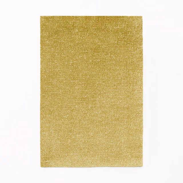 Warm antique-gold velvet swatch with fine shimmering pile and subtle tonal texture