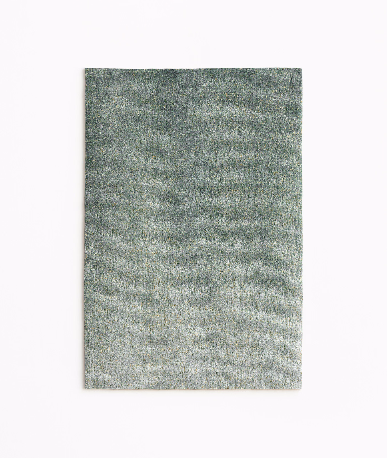 Mottled sage-grey velvet swatch with a fine, softly lustrous texture