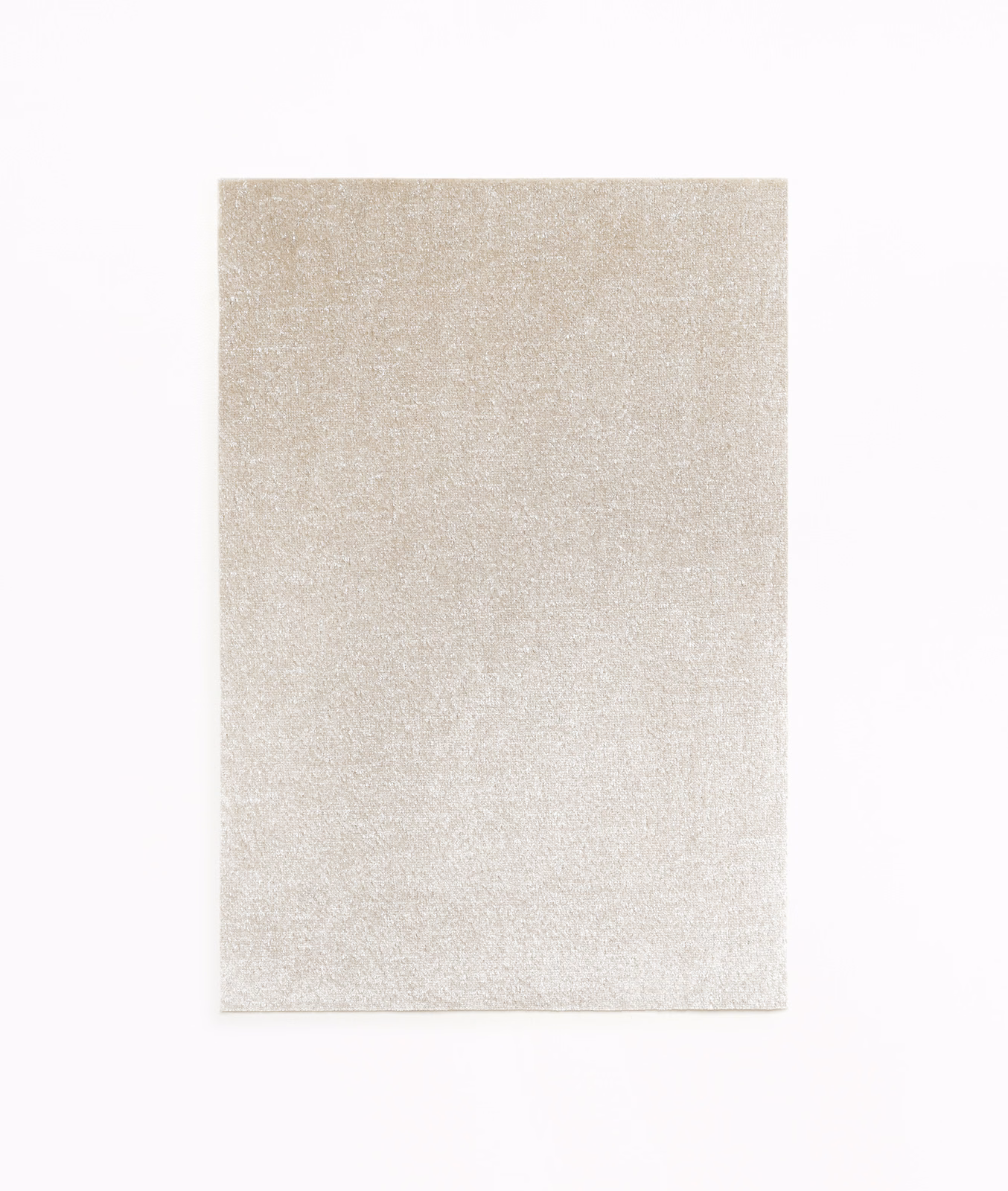 Pale pearl-silver velvet swatch with a softly shimmering, close-cut plush surface