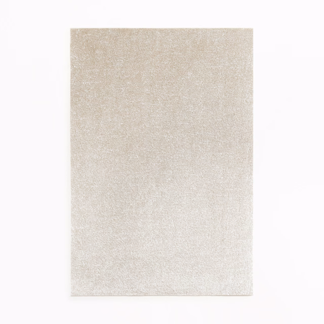 Pale pearl-silver velvet swatch with a softly shimmering, close-cut plush surface