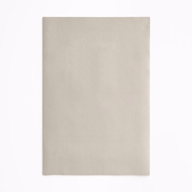 Warm beige velvet swatch with an even, softly light-catching pile