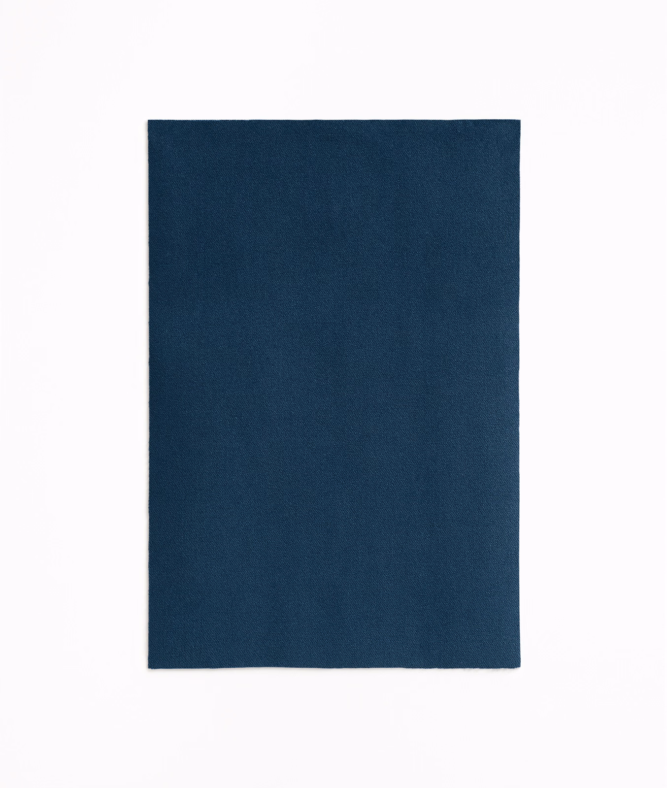 Deep Prussian blue velvet swatch with a plain, softly textured surface