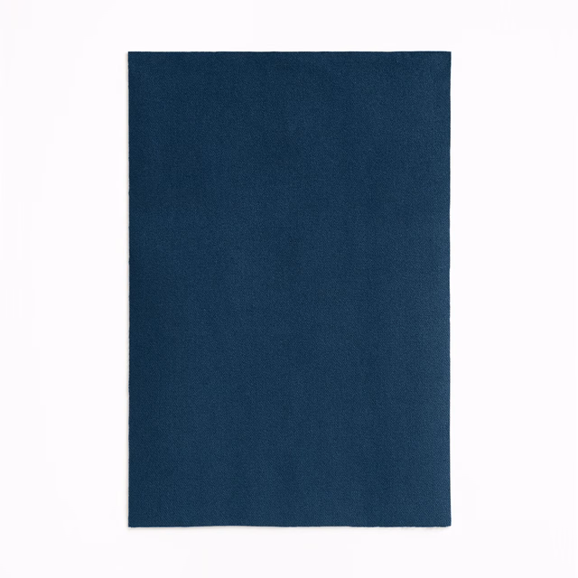 Deep Prussian blue velvet swatch with a plain, softly textured surface