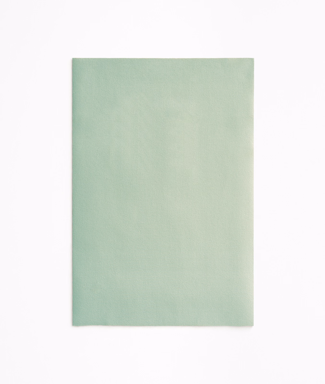 Pale celadon green velvet swatch with softly brushed pile and faint tonal shading