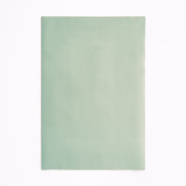 Pale celadon green velvet swatch with softly brushed pile and faint tonal shading
